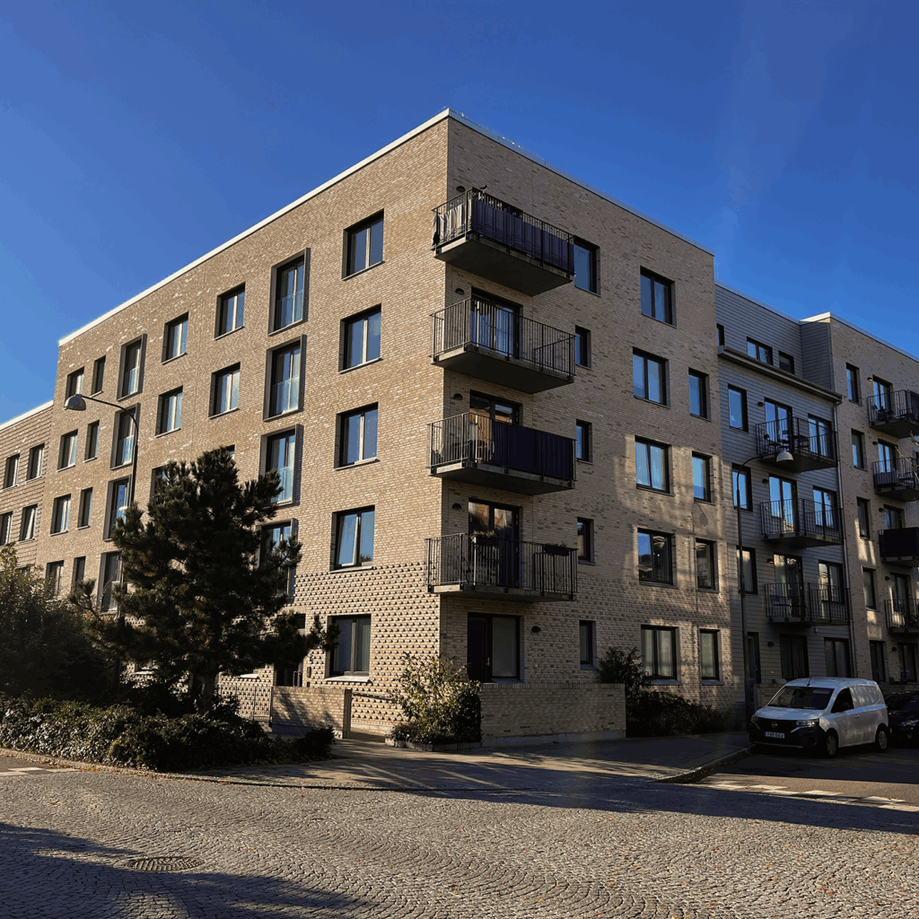 Apartment building in limnhamn sweden, brick & modern